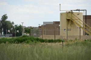 The storage tanks of the former Rider Well are seen Thursday near Trail Ridge Middle School. Concerns about benzene leaks from the well helped energize the anti-fracking movement in Longmont, leading to a fracking ban in 2012