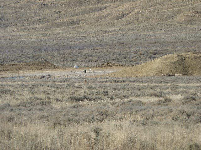 Wellhead with pile of dirt